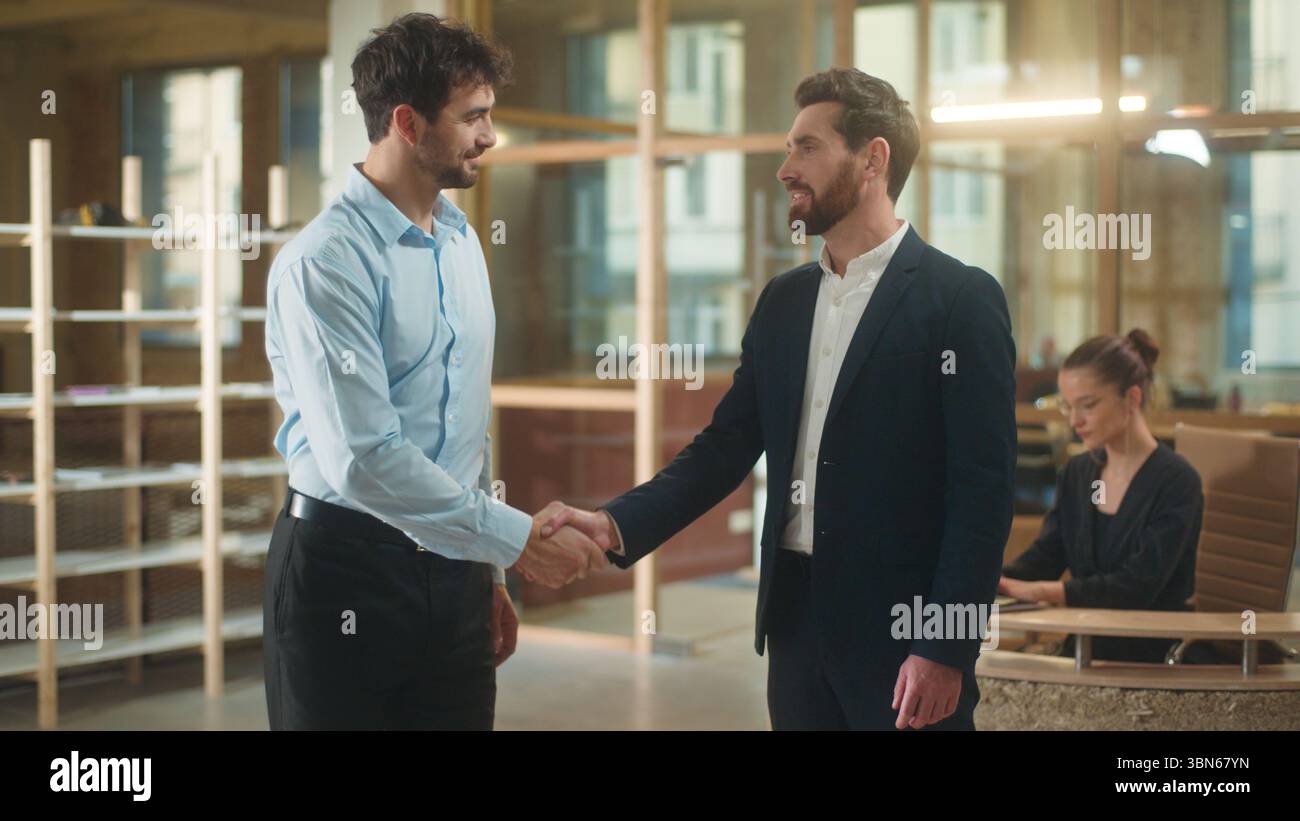 Men shaking hands guys handshake business partners in office smiling ...