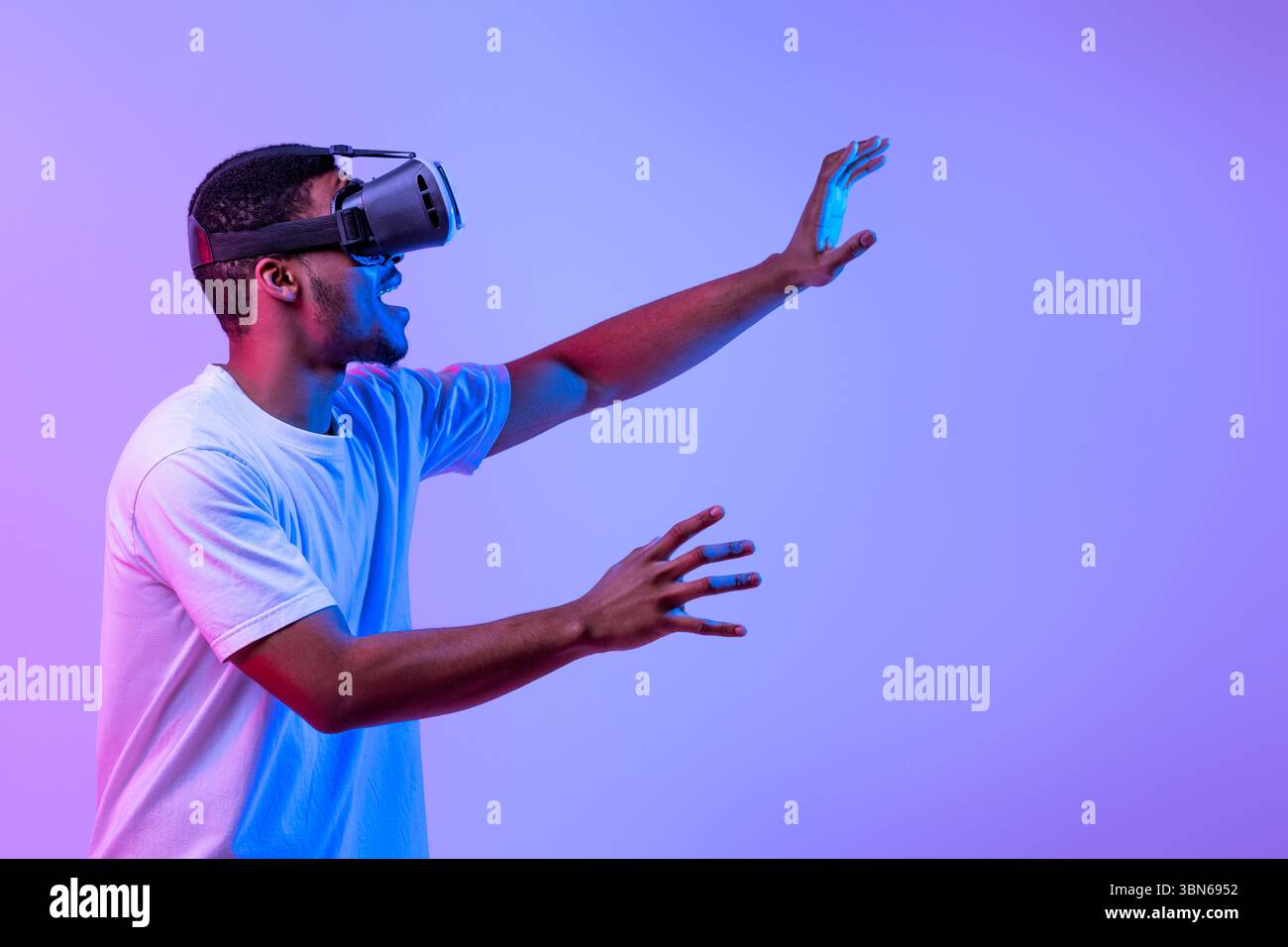 Amazed Black Man Touching Air While Experiencing Virtual Reality In VR ...