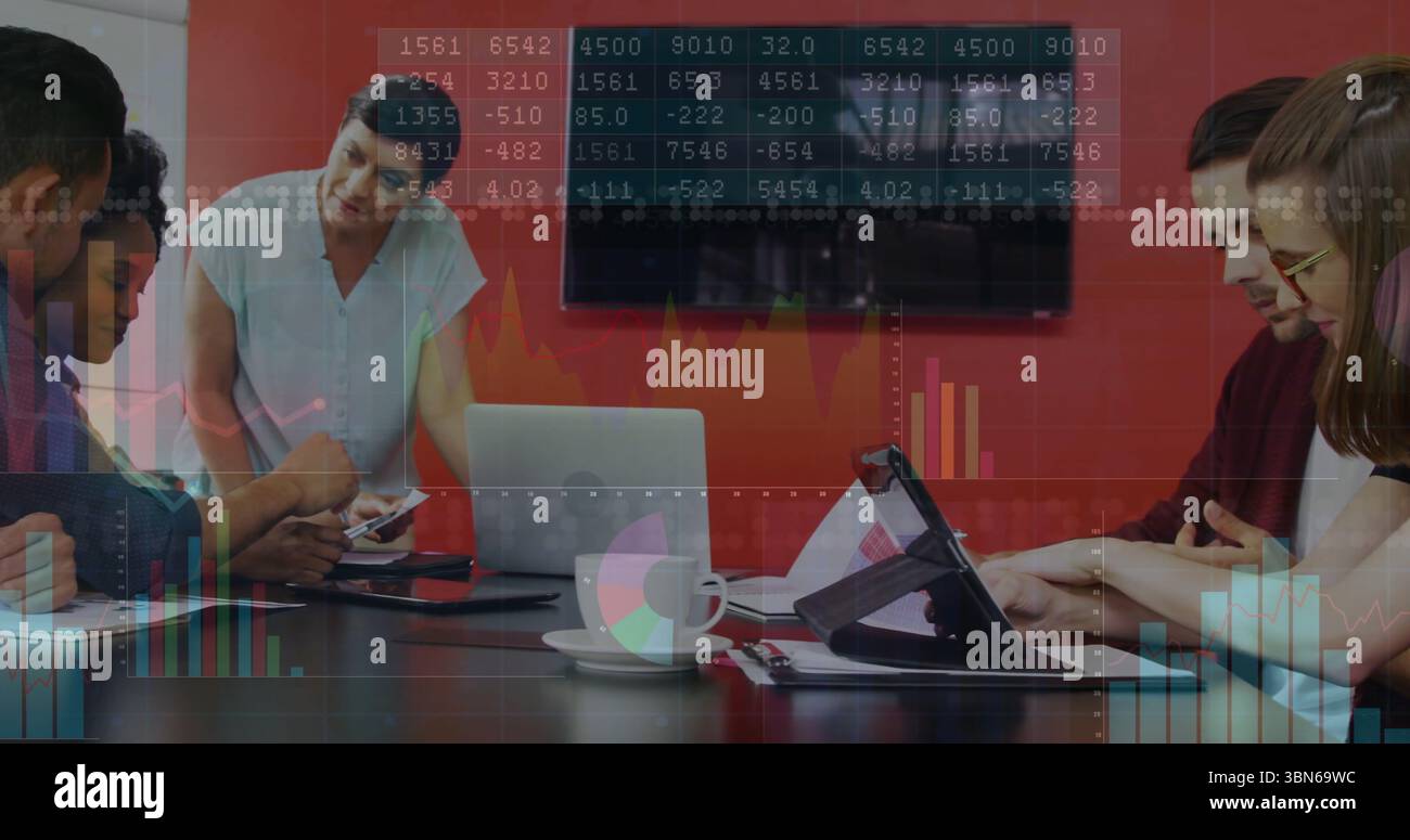 Analyzing financial data and graphs, diverse team in business meeting ...