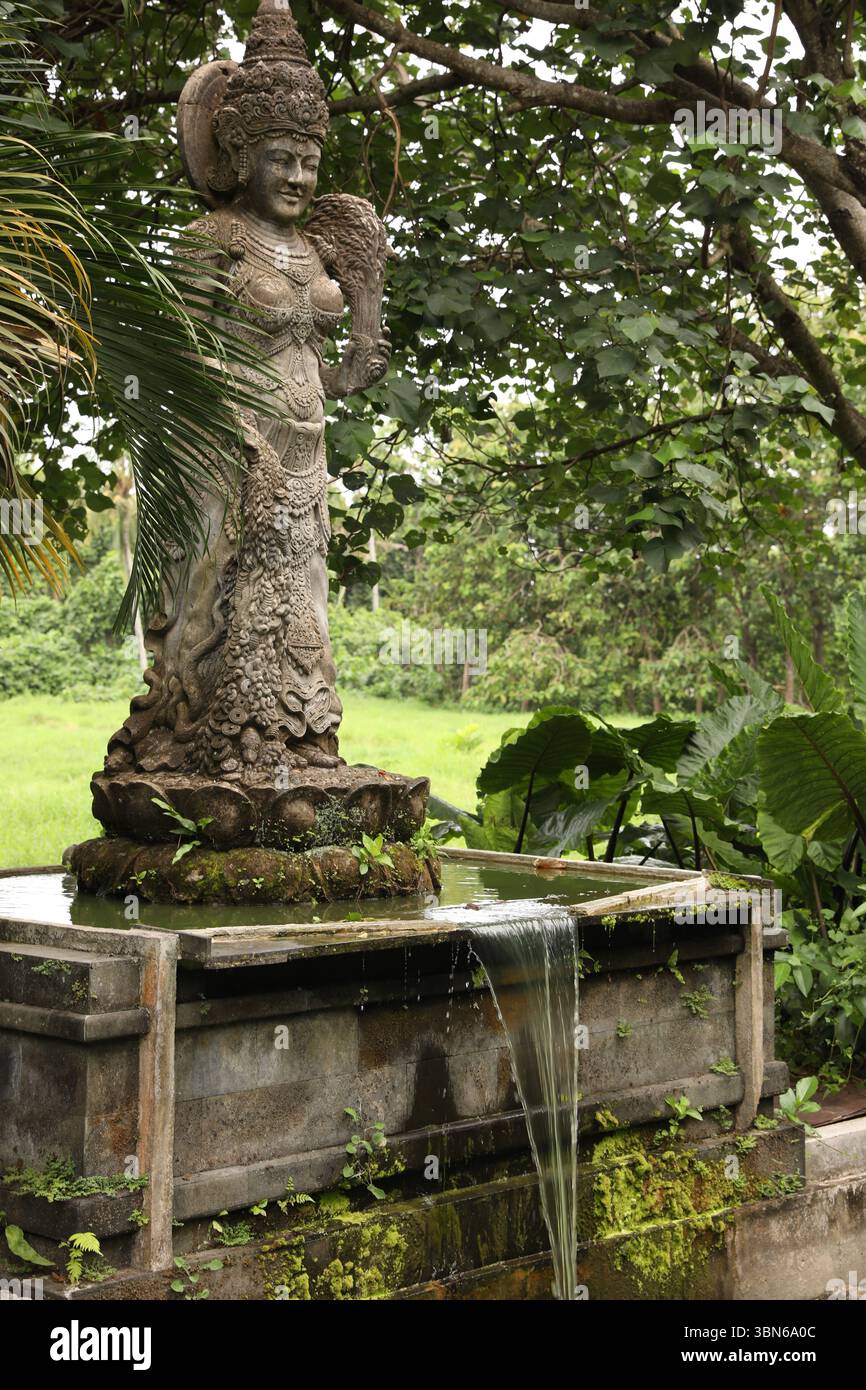 Indonesia island bali statue goddess hi-res stock photography and