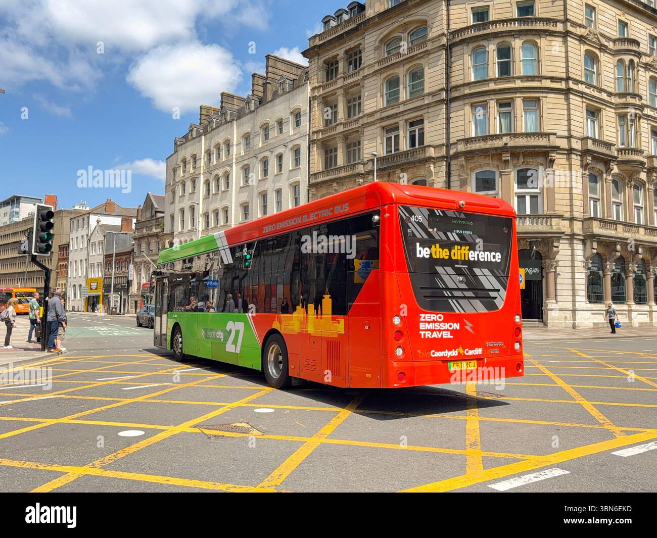 Cardiff, Wales, UK - 18 June 2025: Single deck electric bus operated by Cardiff Bus driving on a road in Cardiff city centre - Smartphone Captured Stock Image