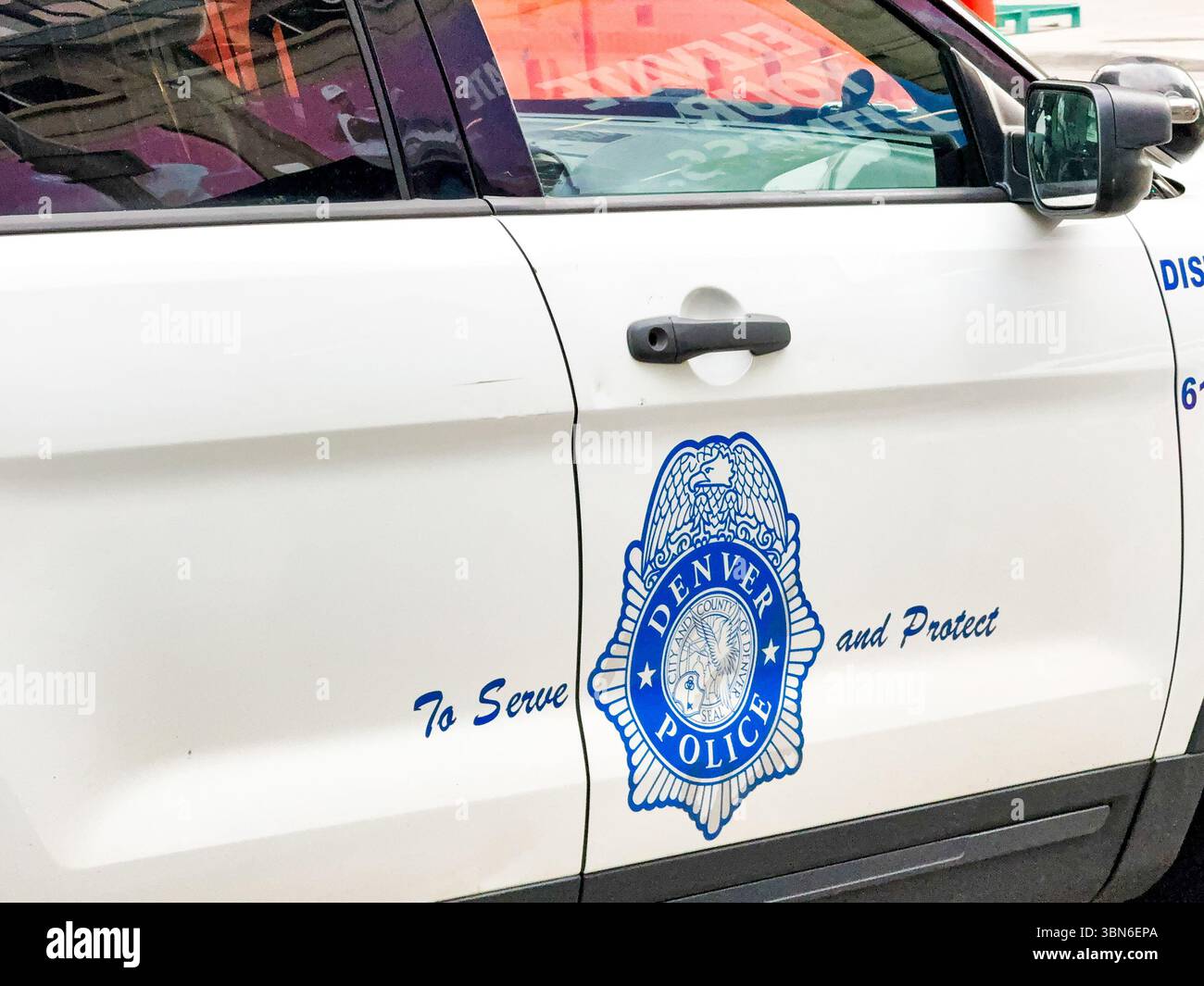 Denver, Colorado, USA - 2 June 2025: Close up view of the badge of the Denver Police Department on a patrol car in the city centre. - Smartphone Captured Stock Image