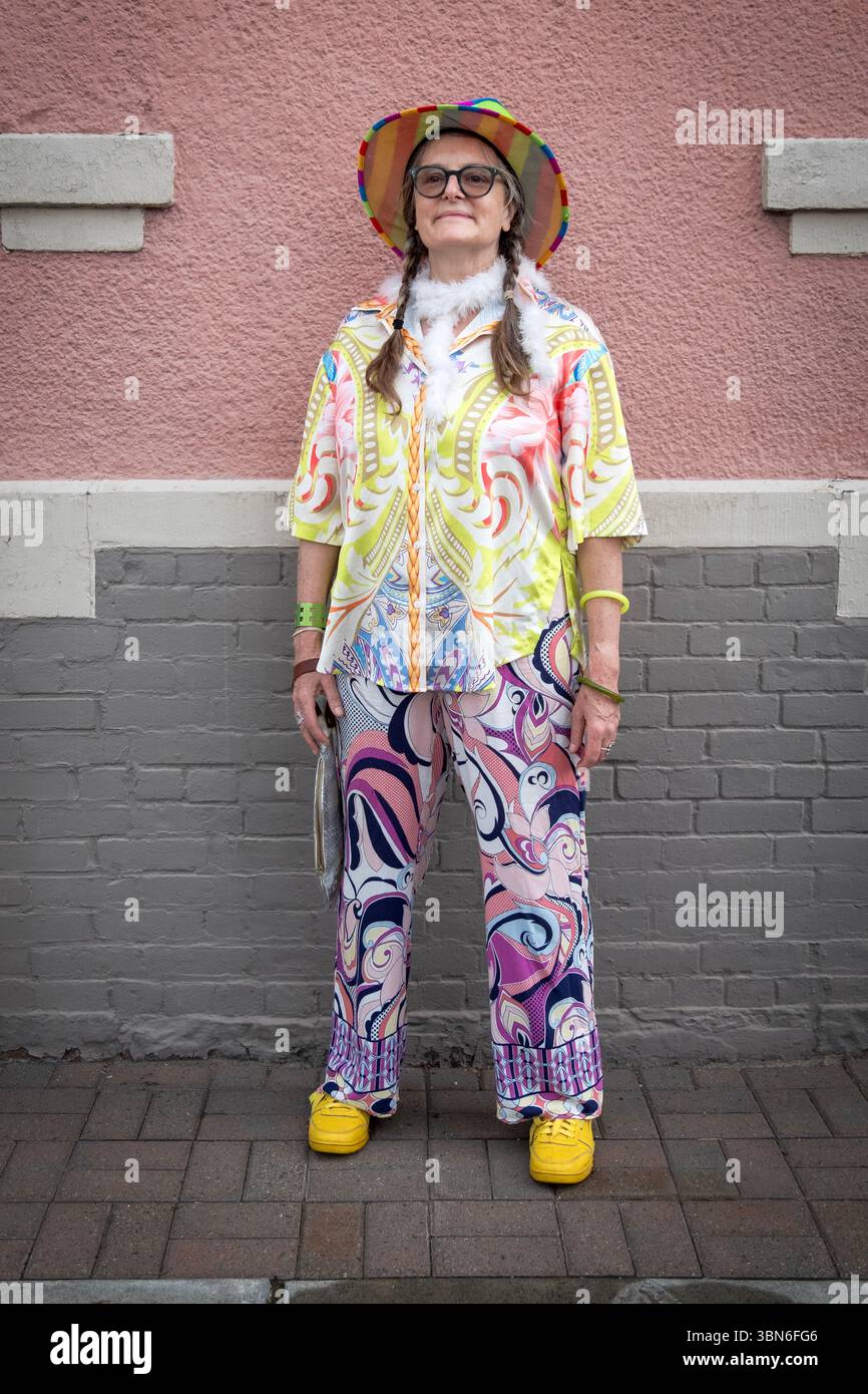A woman with braids and her own individual fashion sense. At the Red Hook Pride Parade in Dutchess county, New York. Stock Photo
