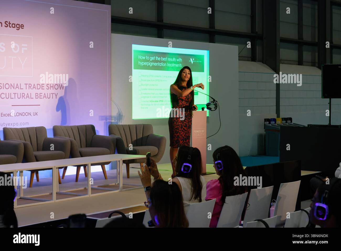 Speaker at the Tones of Beauty Exhibition, ExCel, London Stock Photo