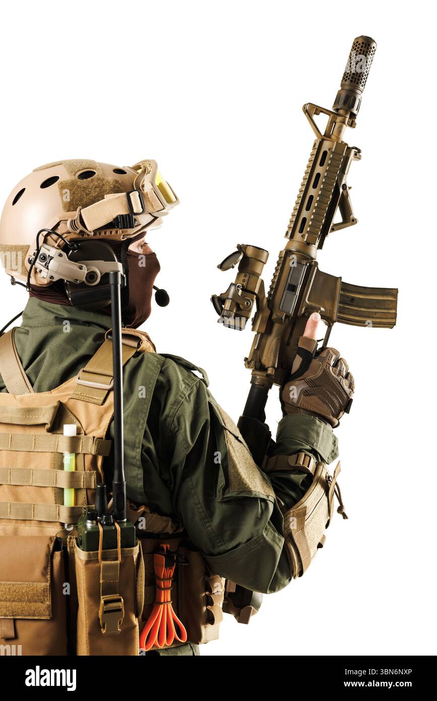 Professional soldier wearing advanced combat gear and wielding a rifle ...