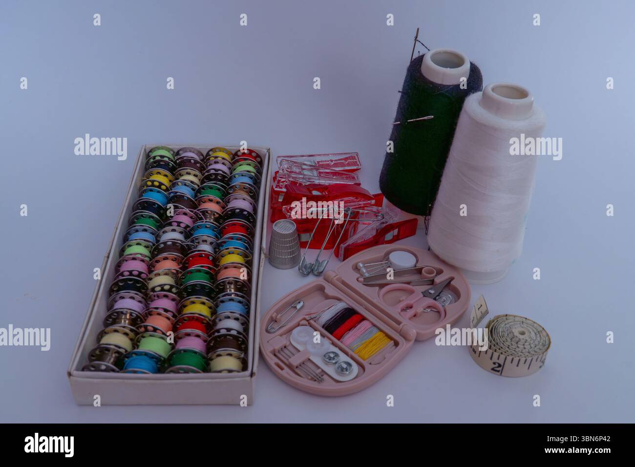 Various sewing accessories on white background Stock Photo