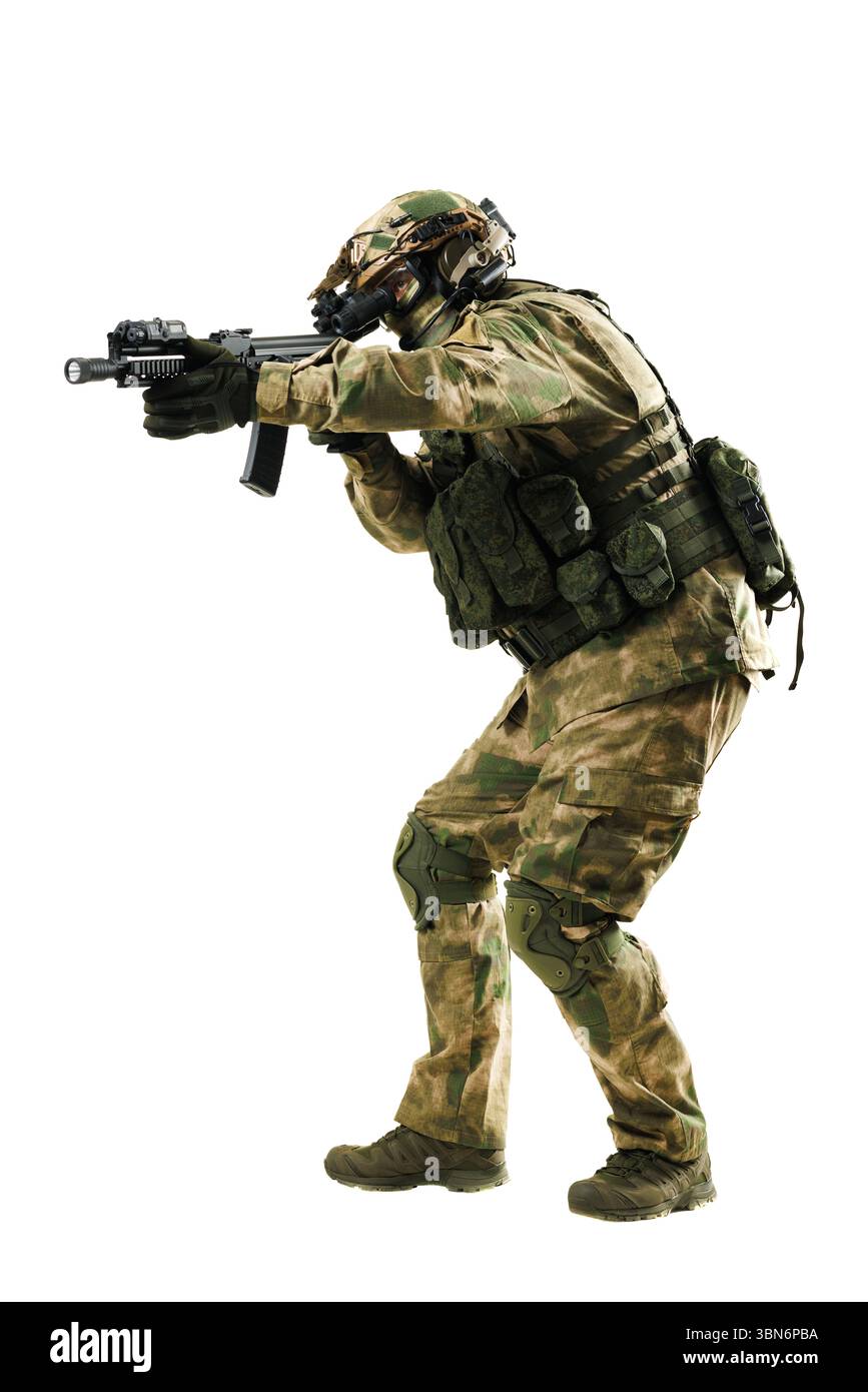 Soldier dressed in camouflage uniform, equipped with tactical gear ...