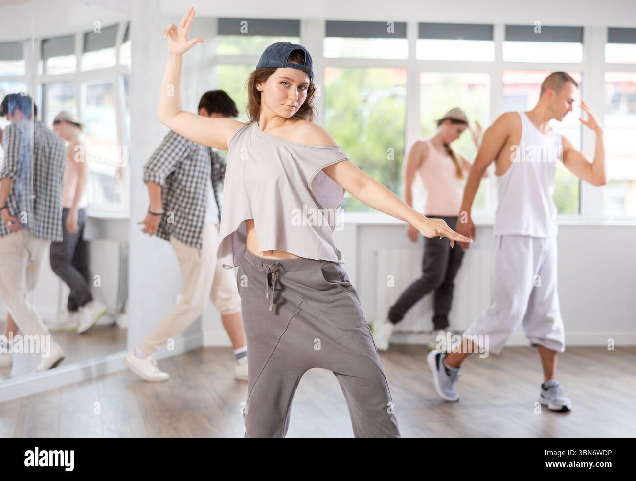 Group of young hip-hop dancers rehearsing in studio. Dancers full of ...