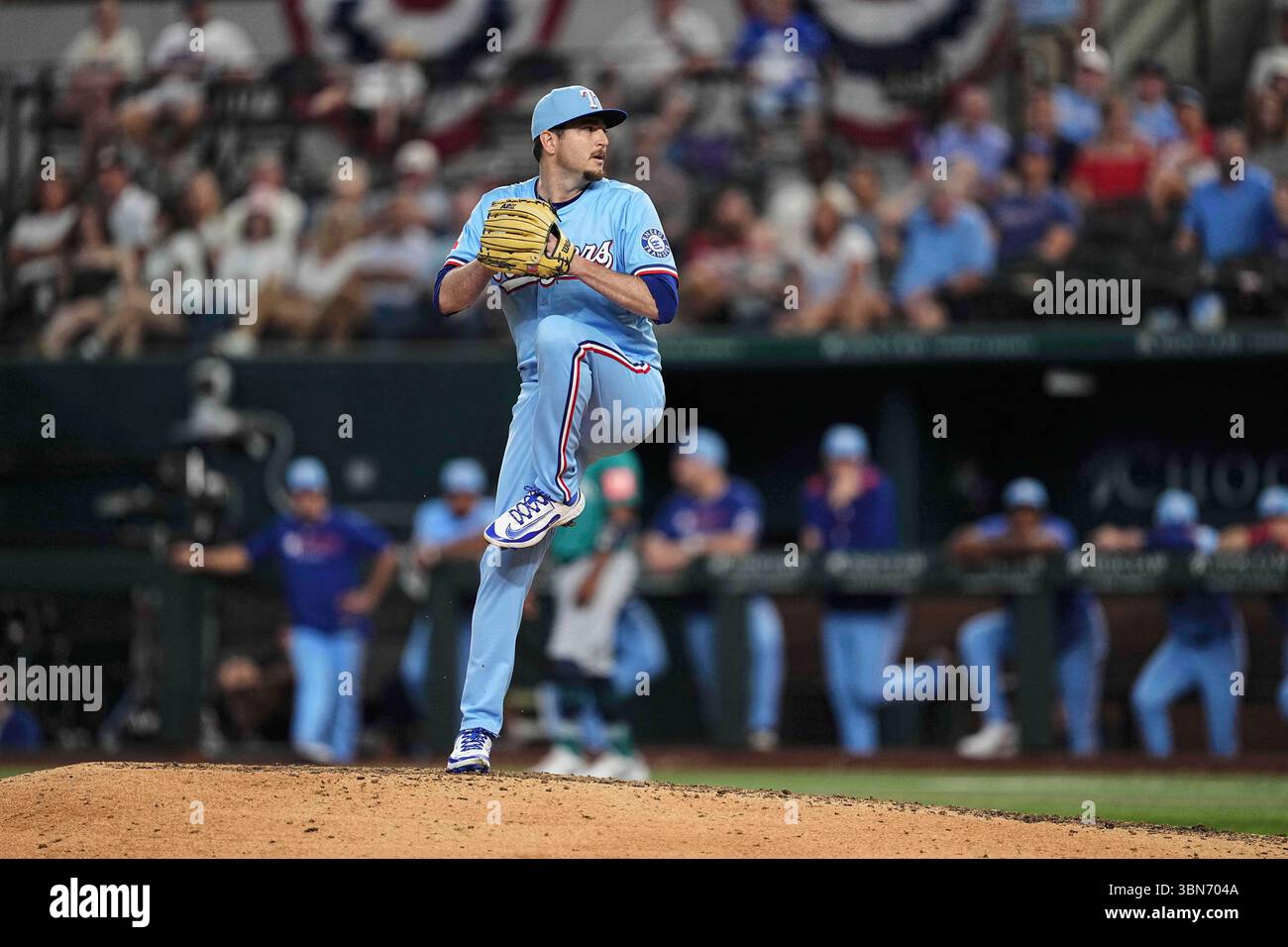Texas Rangers relief pitcher Luke Jackson winds up to deliver to the