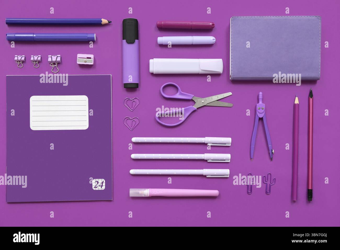 Different stationery on purple background Stock Photo