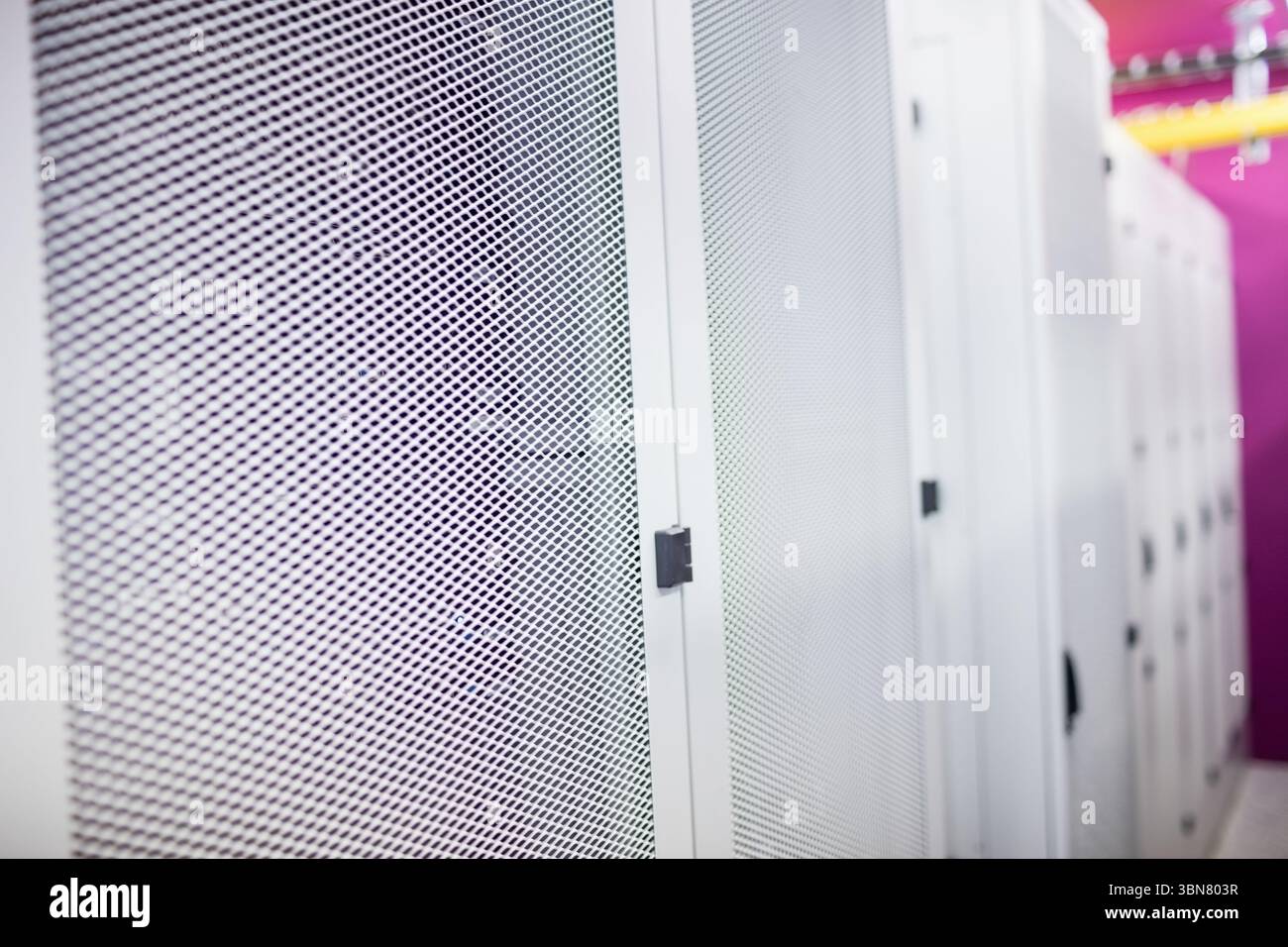 Central server cabinet door is being shown in flat design data center aisle, featuring yellow trays Stock Photo