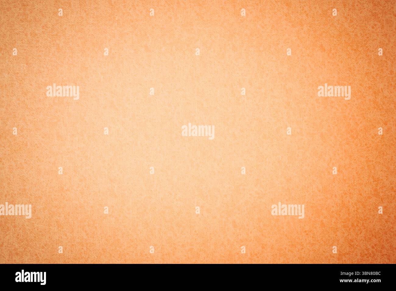 Coarse orange textured surface is filling entire frame in flat design style with subtle gradient Stock Photo
