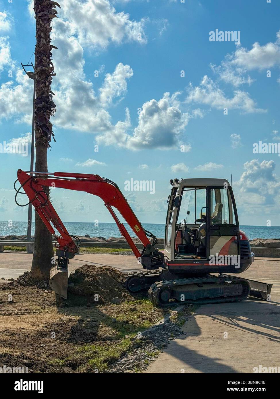 Excavator Scooping Soil and Rocks in Outdoor Construction Zone Stock ...