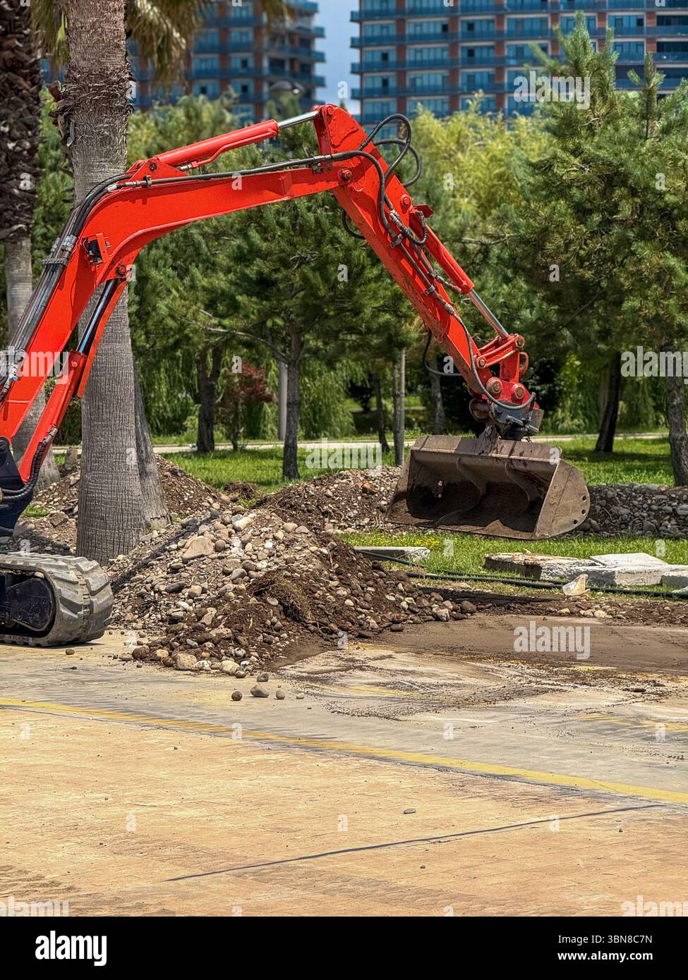 Excavator Scooping Soil and Rocks in Outdoor Construction Zone Stock ...