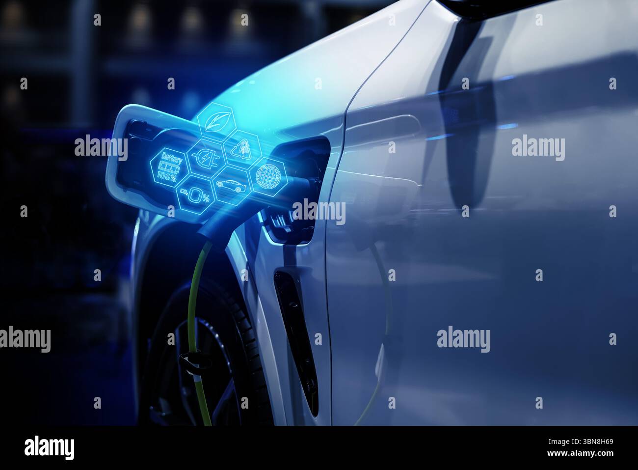 Power cable pump plug in charging power to electric vehicle EV car. Stock Photo