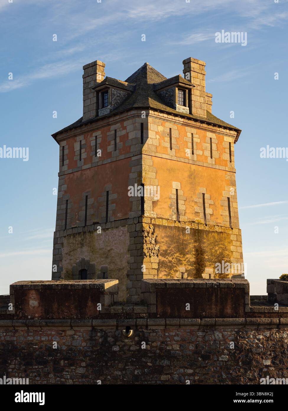 The Vauban Tower, a 17th-century coastal fortification and UNESCO World Heritage site, is seen at sunset in Camaret-sur-Mer. Stock Photo