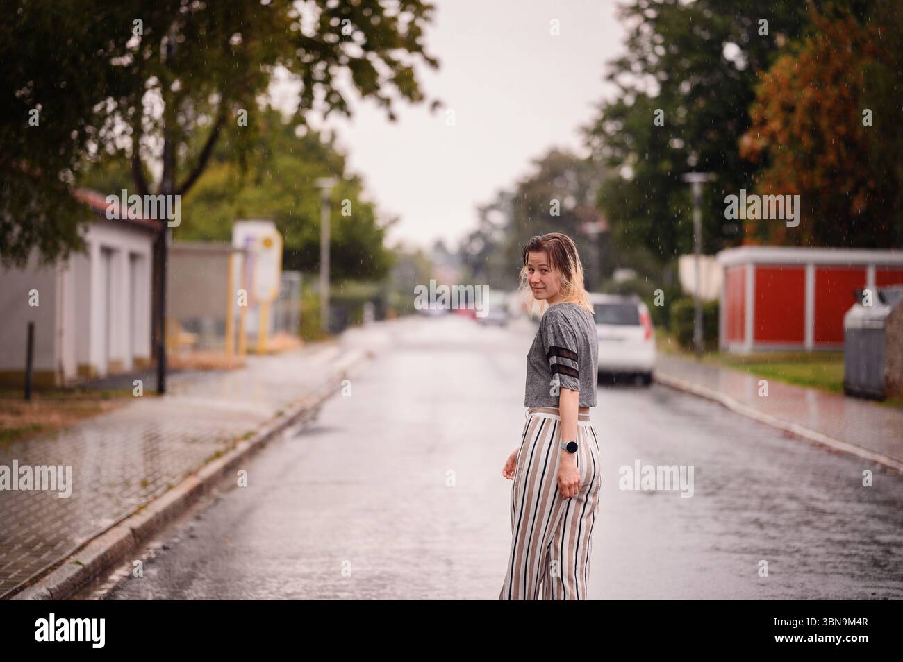 Woman walking barefoot street hi-res stock photography and images - Alamy