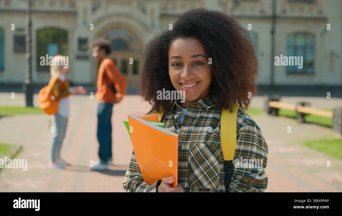 Happy positive toothy smiling African American student girl female ...
