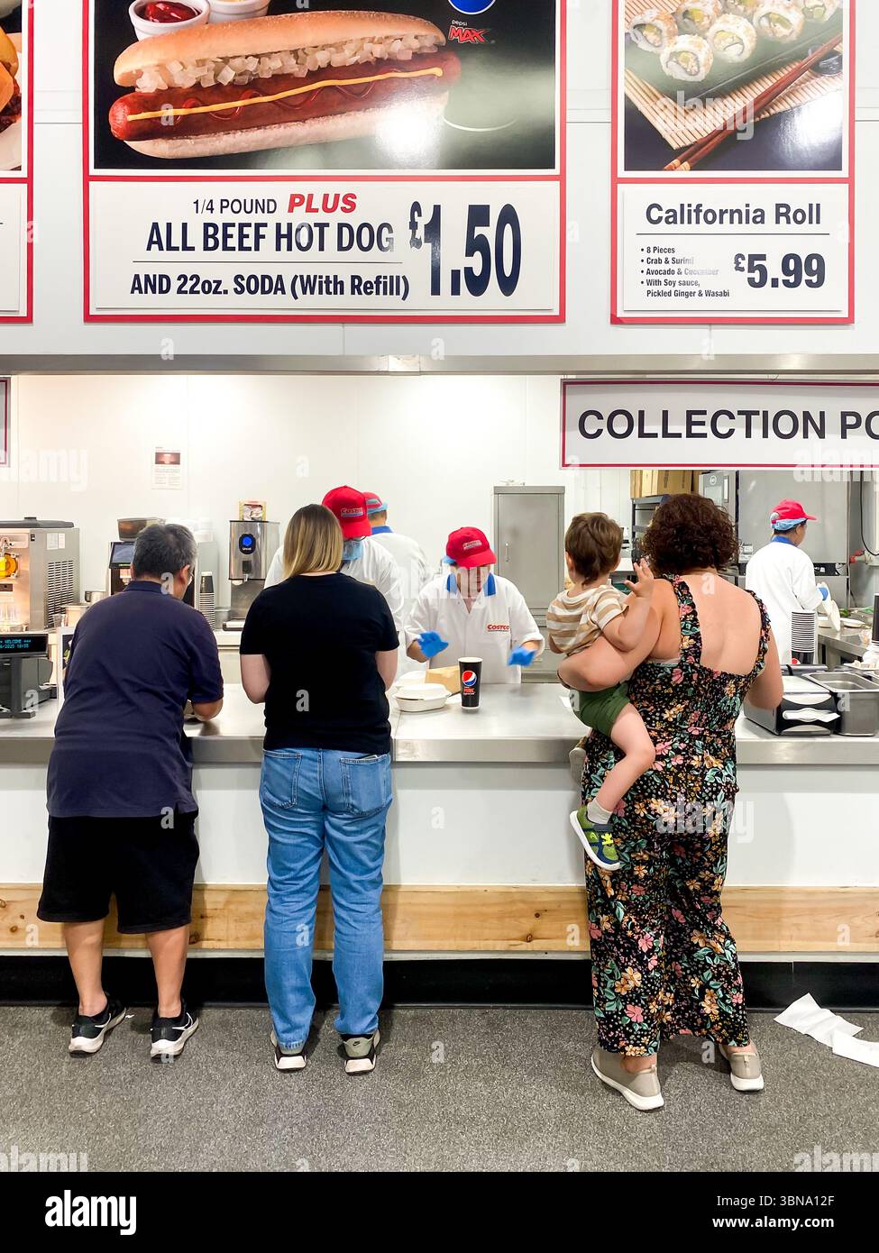 Customers collect food at a cafe in a Costco store in The UK - Smartphone Captured Stock Image