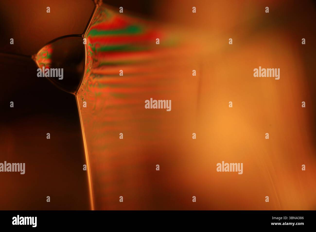 Orange coloured liquid surface, fluid effect, bright chemistry Stock Photo