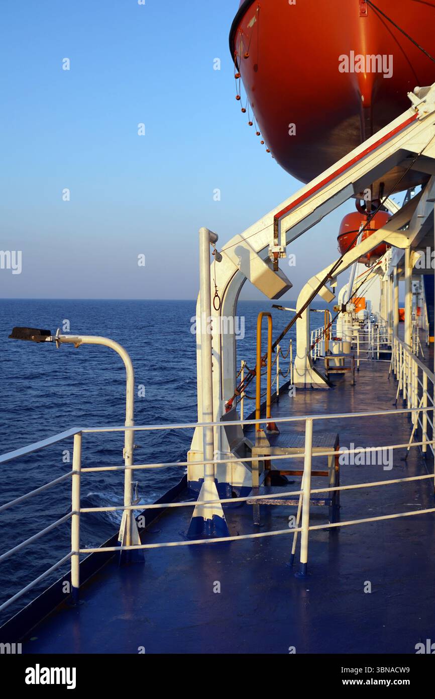 The image captures the deck of a ship, painted in a striking ...