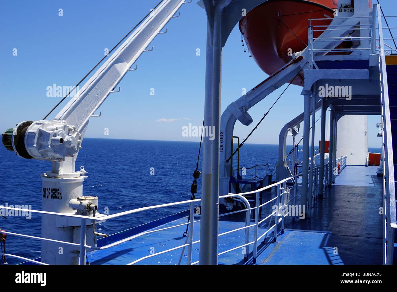 A view from the deck of a ship, likely a cargo or passenger vessel, as ...