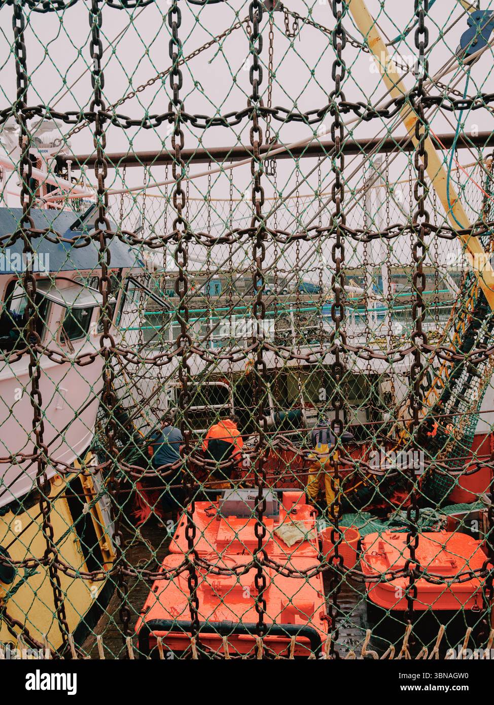 A trawler undergoing repairs in the fishing port of Newlyn, Penzance, Cornwall England UK - fishing industry Stock Photo