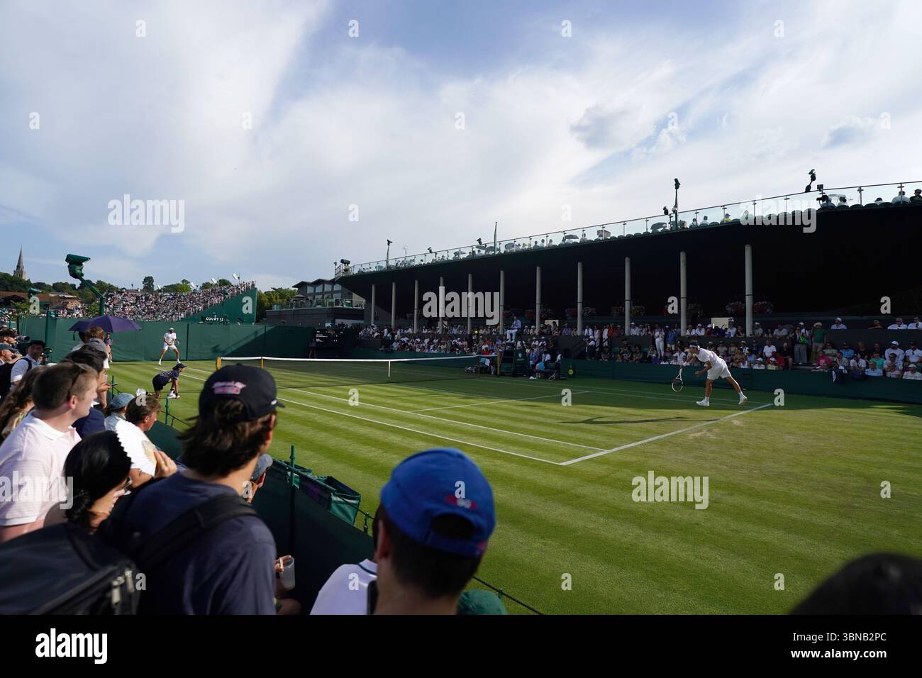 General view of Alexander Shevchenko and Reilly Opelka during their match on day two of the 2025 Wimbledon Championships at the All England Lawn Tennis and Croquet Club, London. Picture date: Tuesday July 1, 2025. Stock Photo