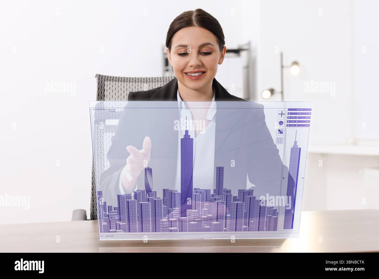 Building information modelling. Woman using virtual screen in office Stock Photo