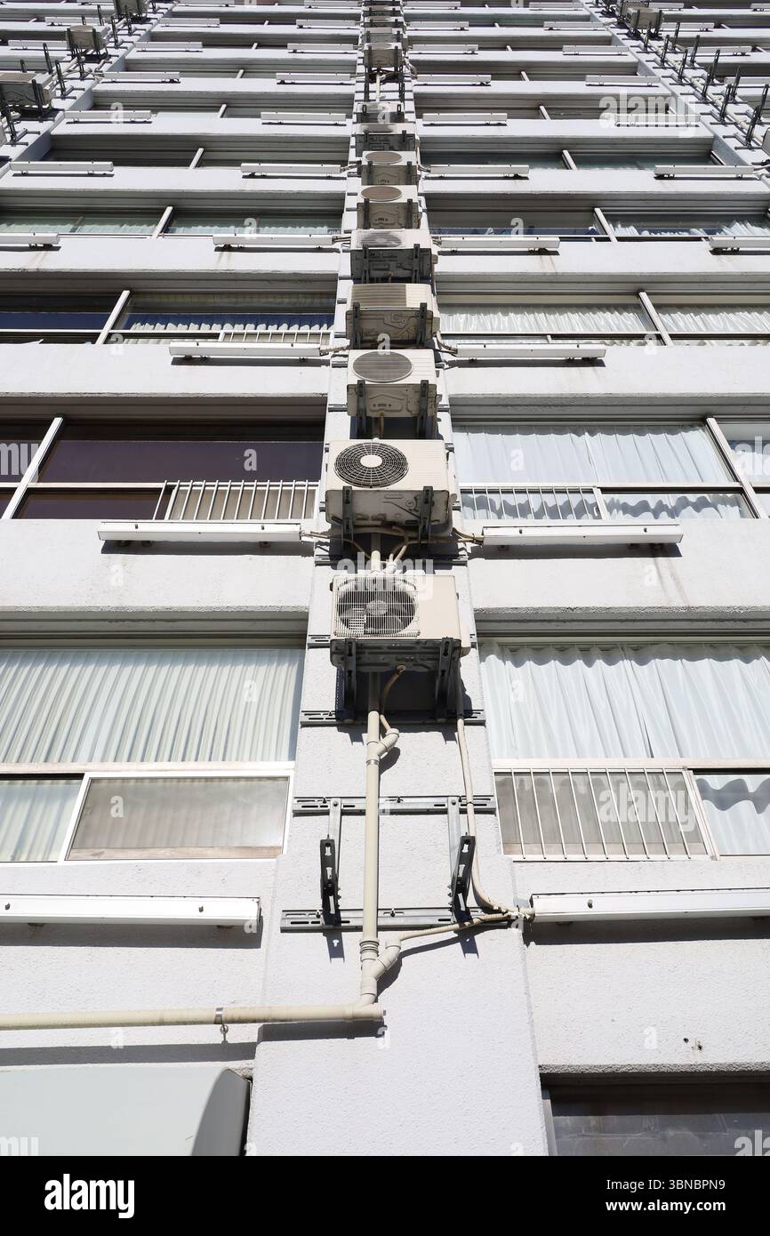 Picture of Neatly arranged air conditioning units on the wall of a vintage ...