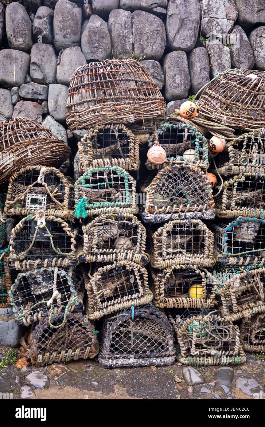 Crab and lobster fishing pots stacked in famous harbour village of ...