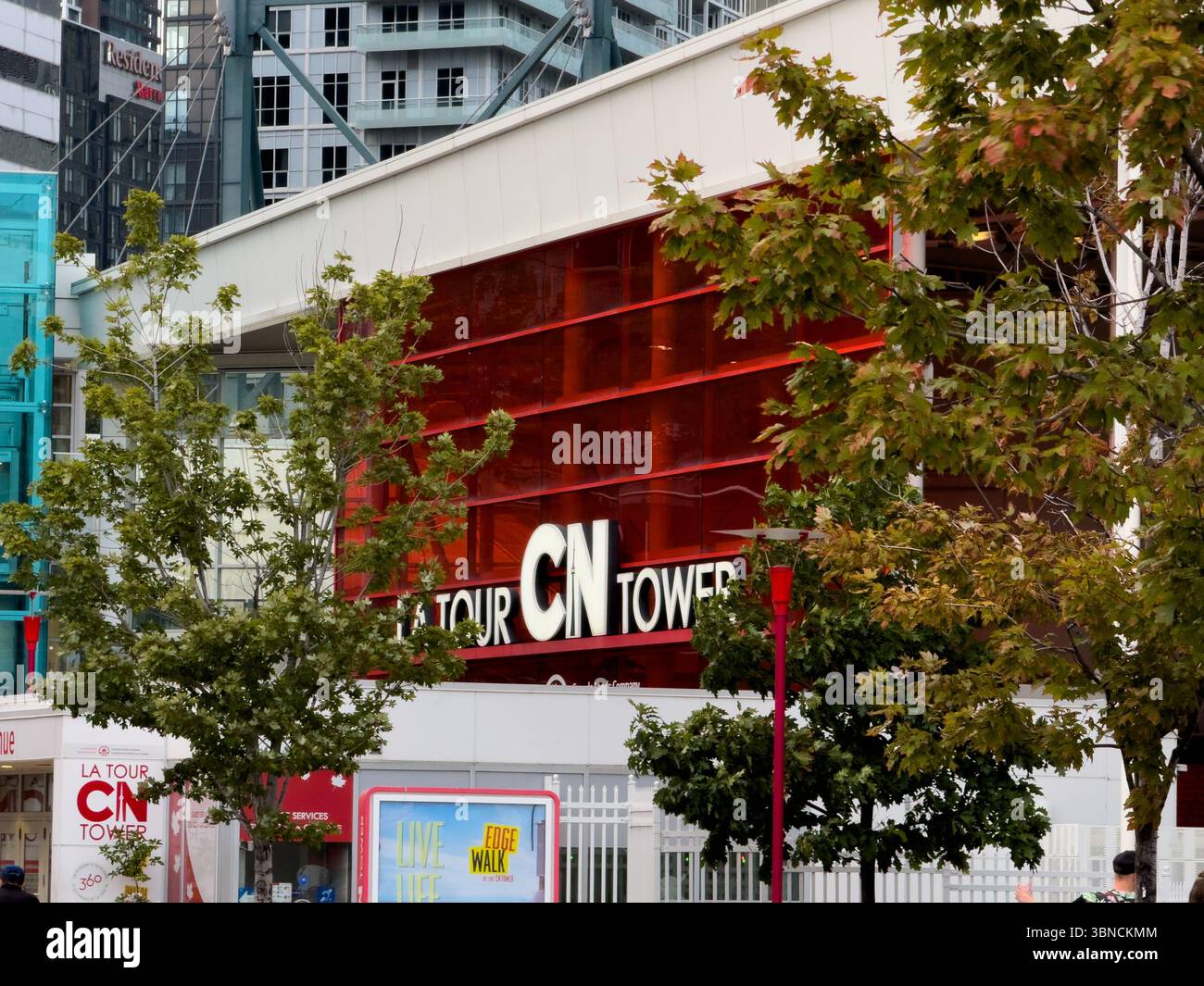 The CN Tower logo, signage seen at base of the iconic building and ...