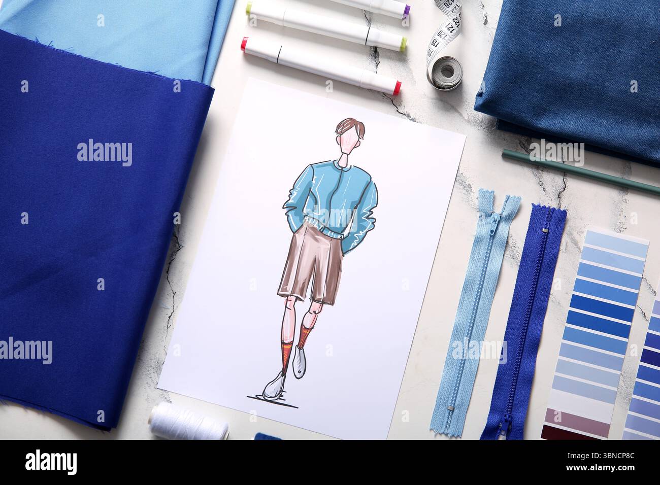 Composition with fabric and sketch of male clothes on light background ...