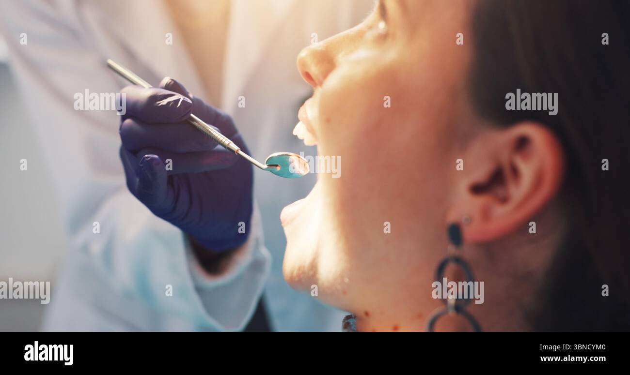 Dental mirror, consultation and dentist with woman for treatment of ...