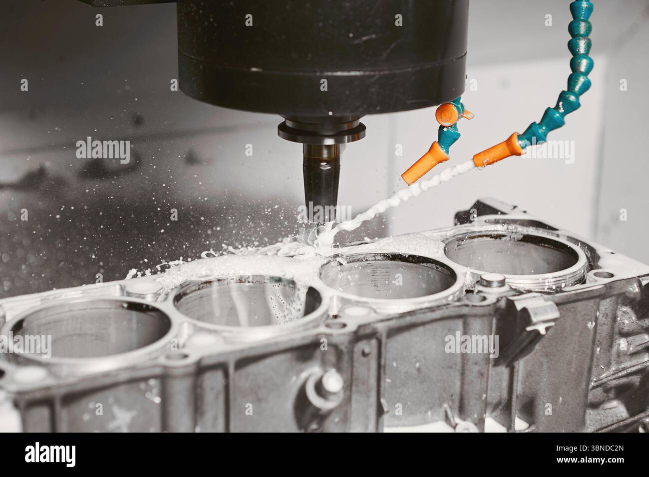 Milling Machine Making Engine CNC milling machine grinds holes in car engine with coolant. Process of ...