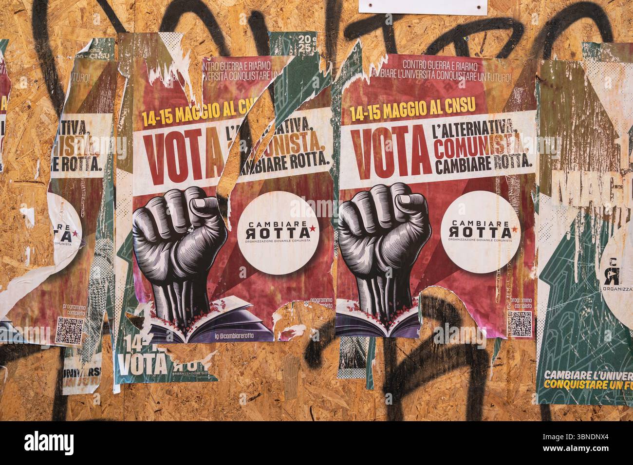 Ripped left wing political poter and graffiti in the student quarter of Bologna Italy Stock Photo