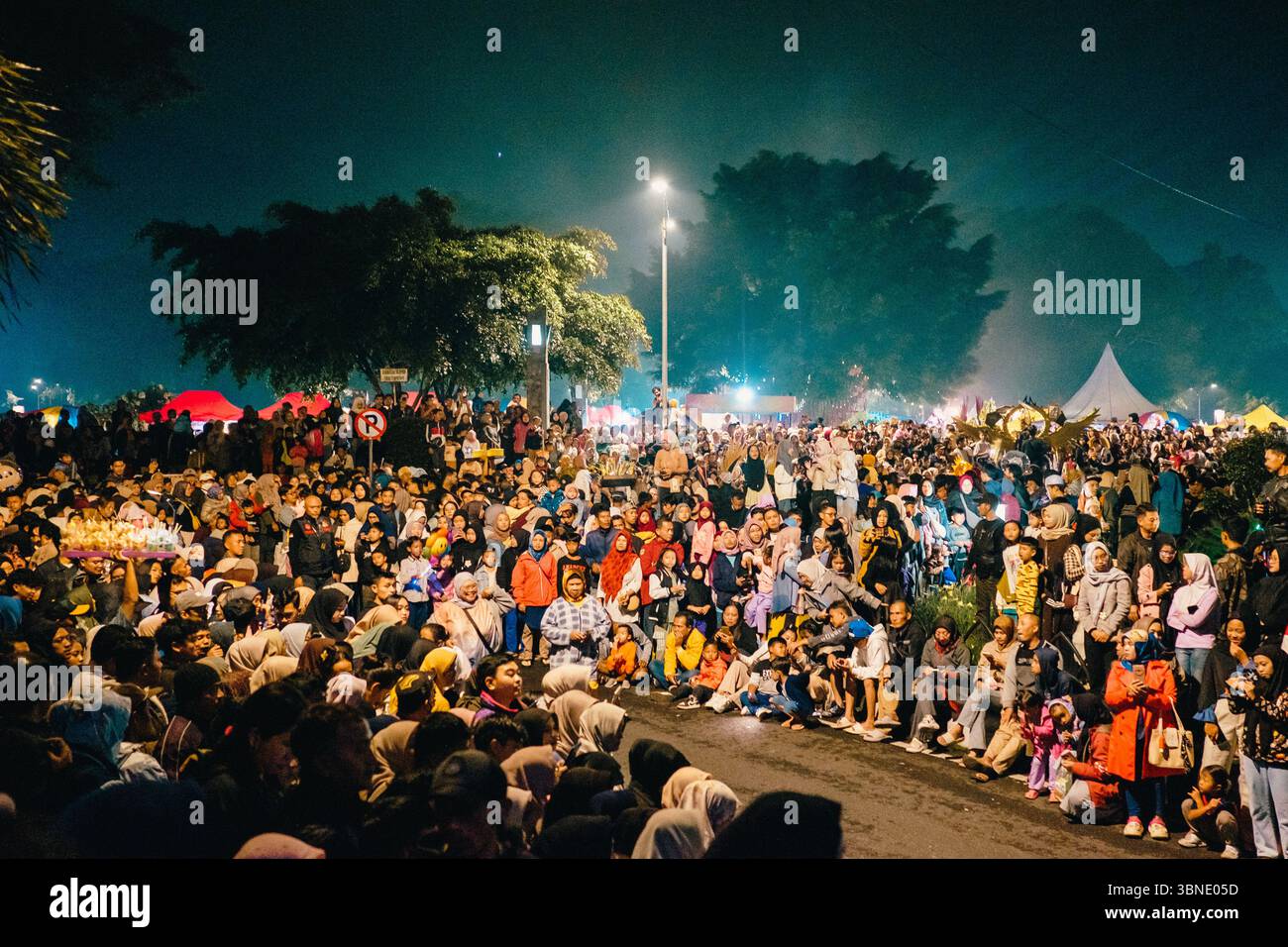 Crowd of spectators enjoying live performances at Wonosobo Night Festival, Central Java, Indonesia Stock Photo