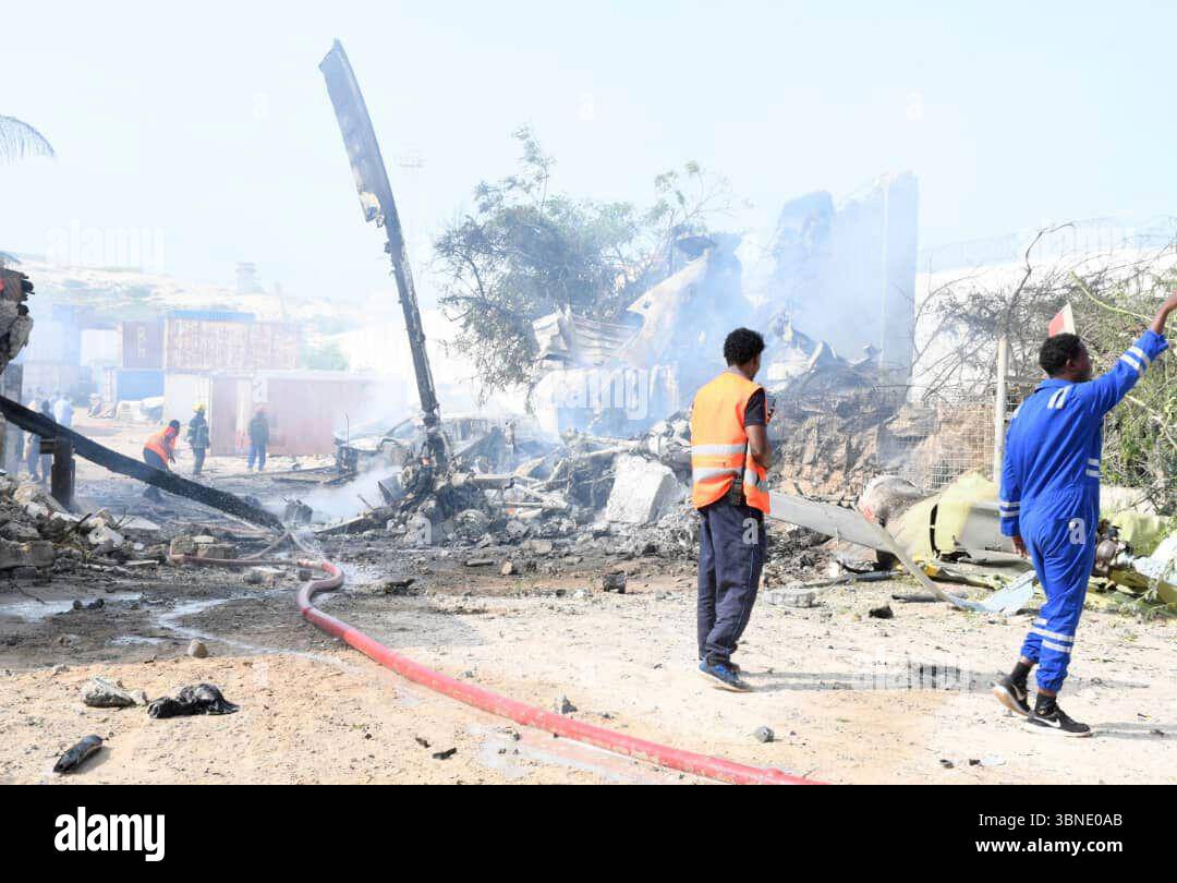 Rescue efforts take place at the site after an African Union military ...