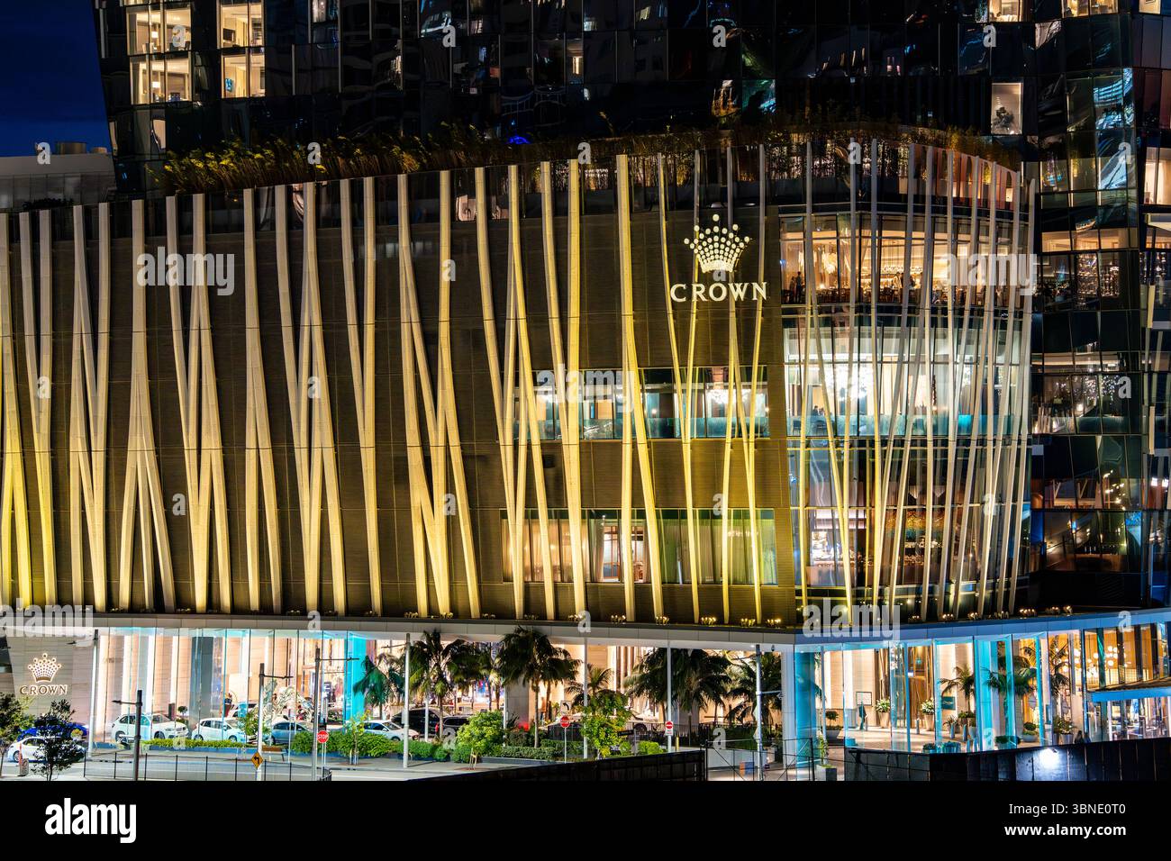 A view of the lower exterior of Crown Resorts Australia's Crown Casino Hotel in Sydney Australia at night Stock Photo