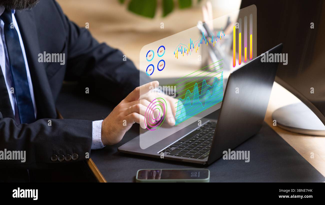 Businessman using futuristic transparent touchscreen interface to analyze real time financial data Stock Photo