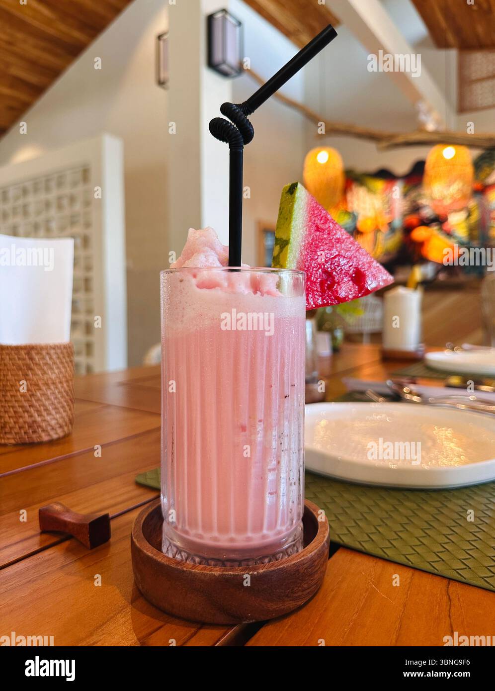 Banana strawberry smoothie in a clear wavy glass. - Smartphone Captured Stock Image