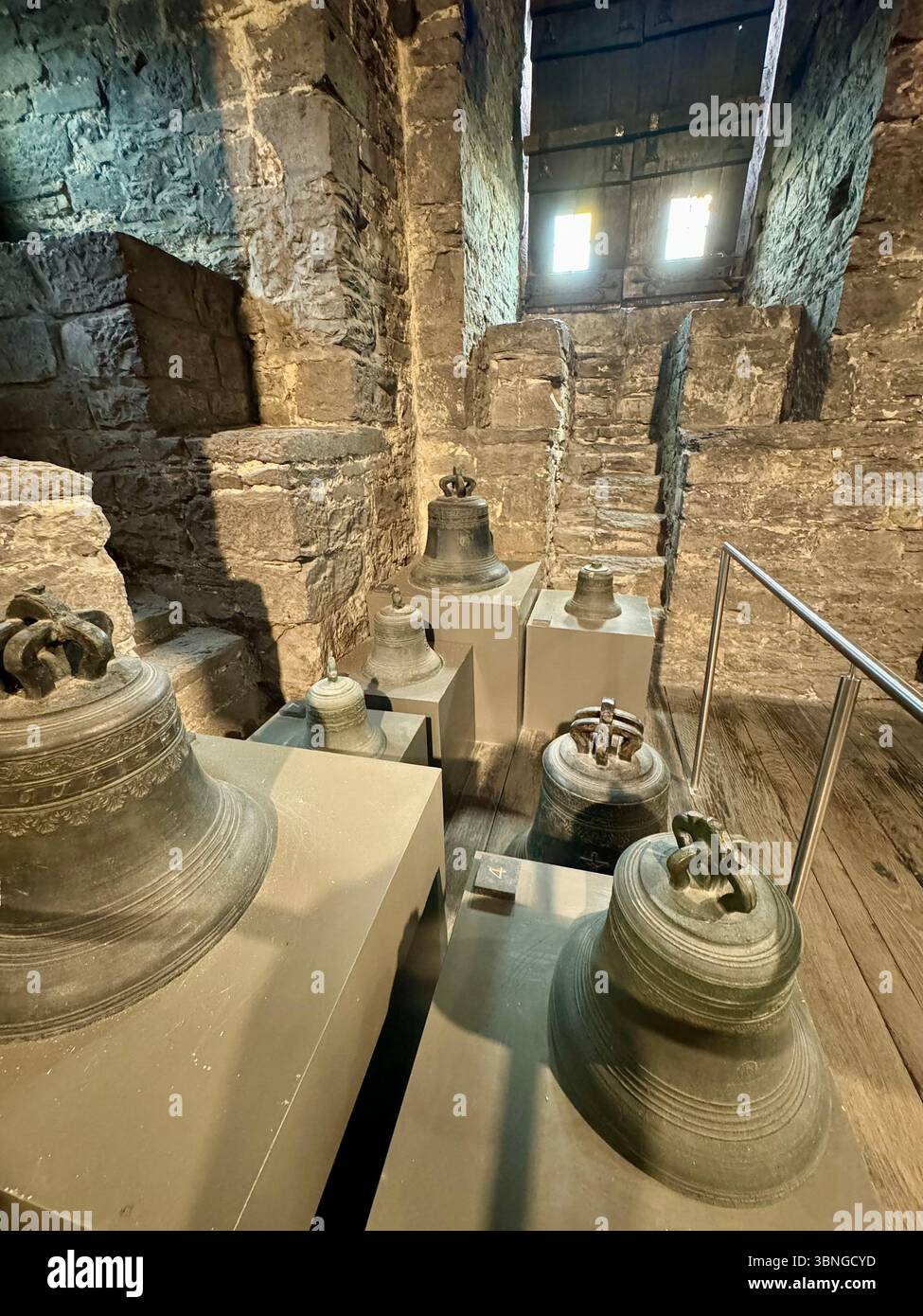 Collection of historic bronze bells displayed in the Belfry of Ghent (Belfort van Gent) museum, Belgium. - Smartphone Captured Stock Image Collection of historic bronze bells displayed in the Belfry of Ghent (Belfort van Gent) museum, Belgium. - Smartphone Captured Stock Image