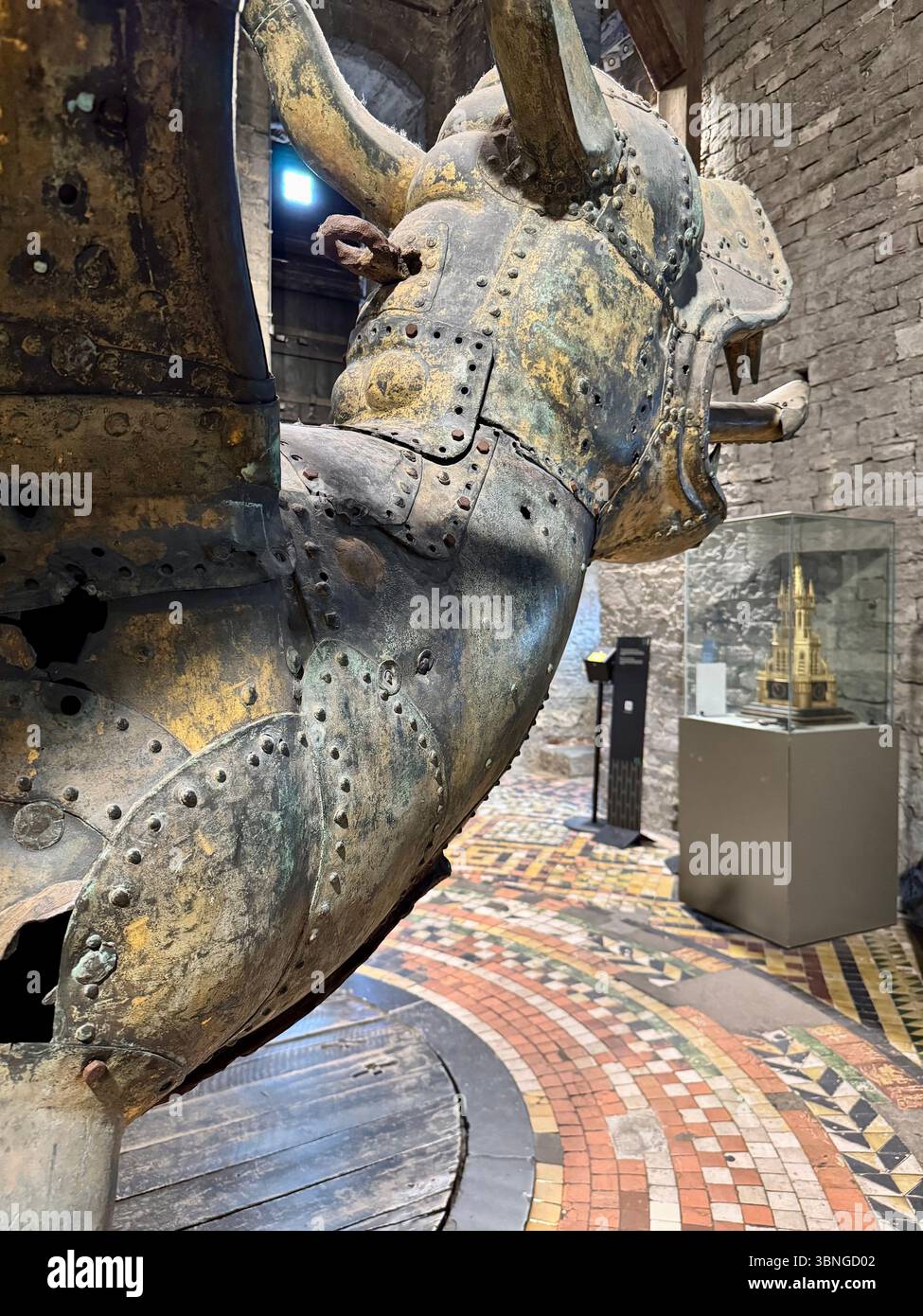 Medieval gilded dragon weather vane displayed inside the Belfry of Ghent (Belfort van Gent) museum, Belgium. - Smartphone Captured Stock Image