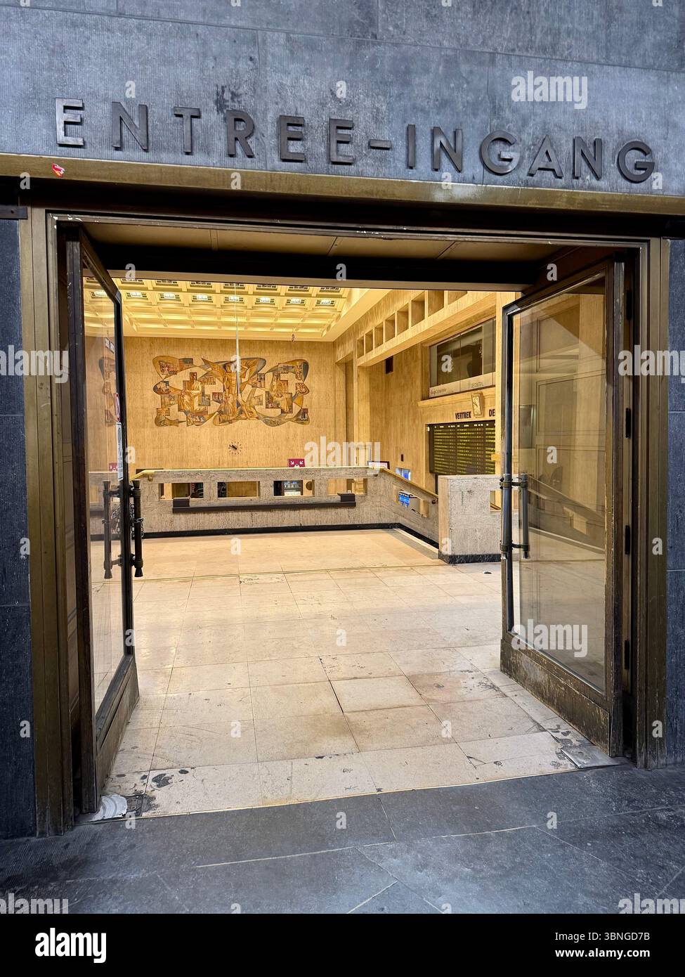 Main concourse of Brussels-Central railway station with arched glass roof and bustling passenger area, Brussels, Belgium. - Smartphone Captured Stock Image