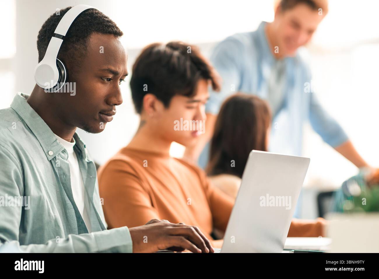 Colleagues working on a project using technology Stock Photo
