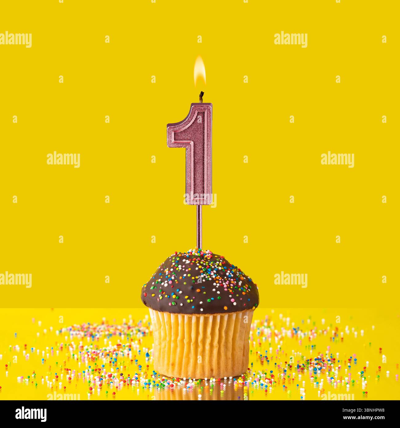 Number 1 candle - Birthday candle with chocolate cupcake Stock Photo