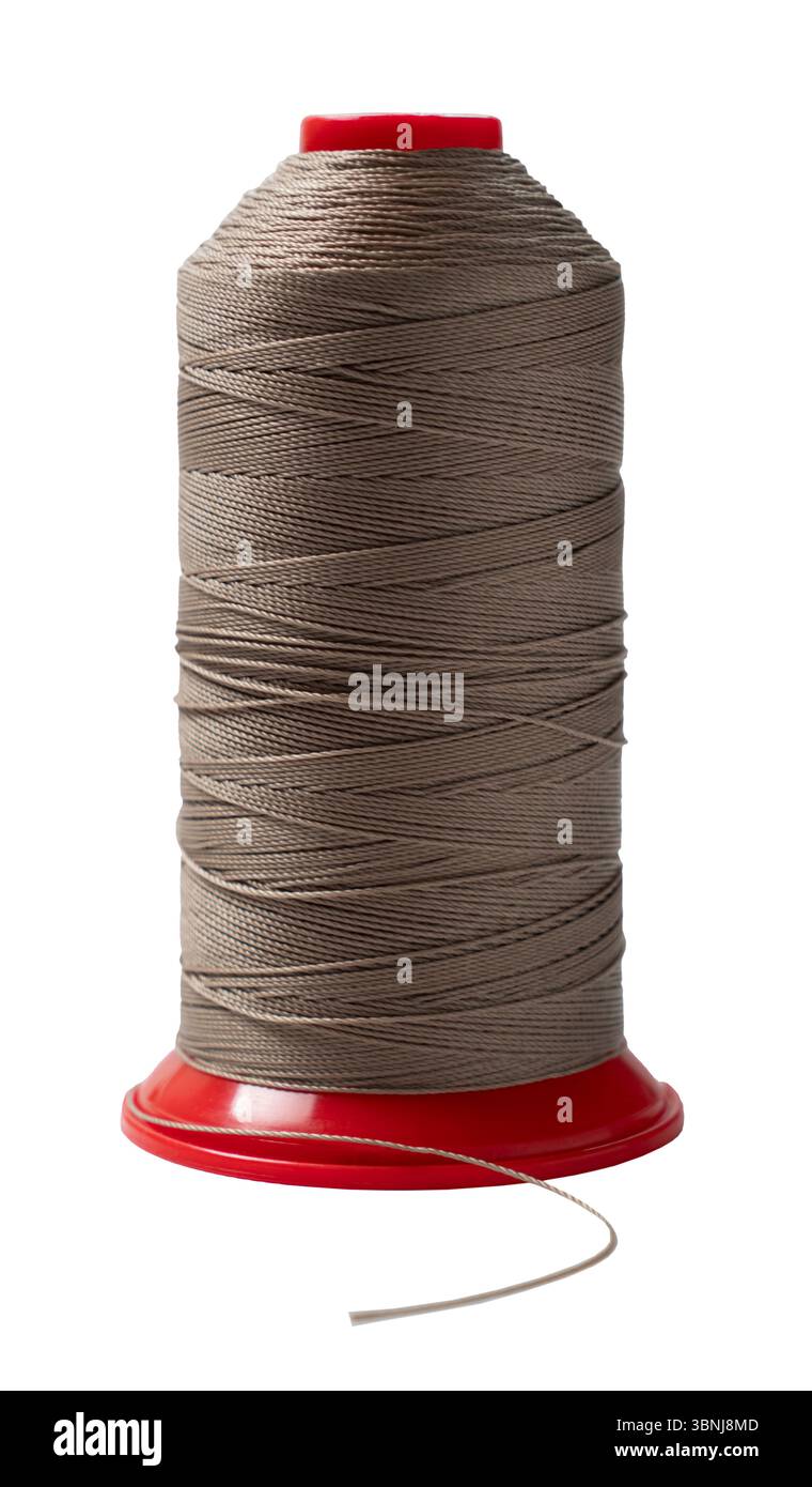 spool of sewing thread close up on white background Stock Photo - Alamy