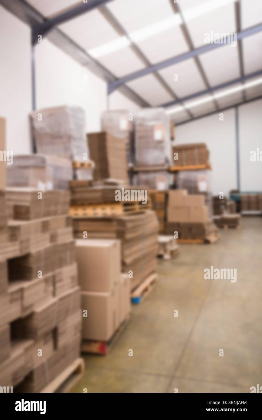 Stack of cardboard boxes against wall Stock Photo