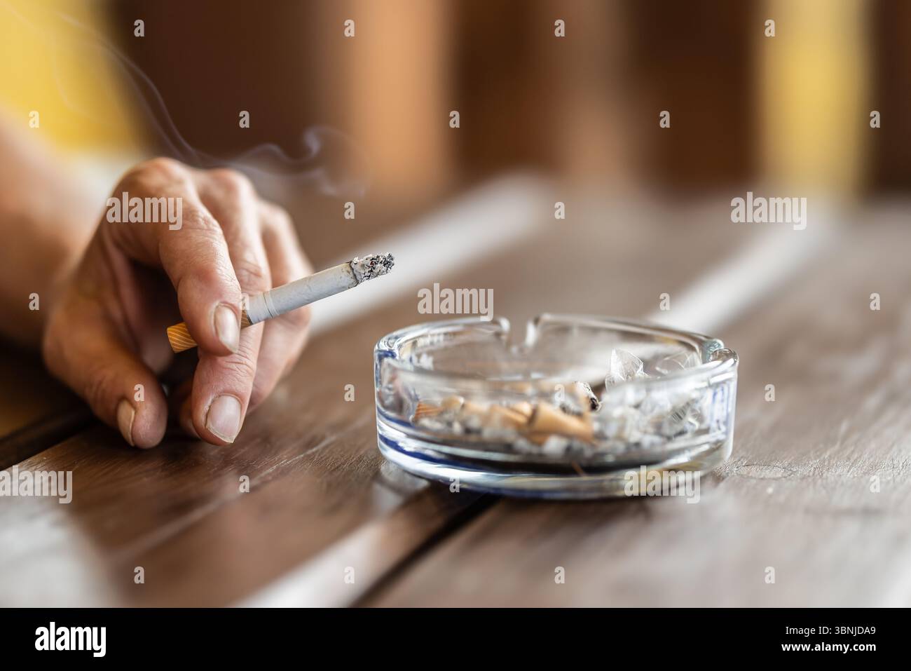 Cigarette hand smoke hi-res stock photography and images