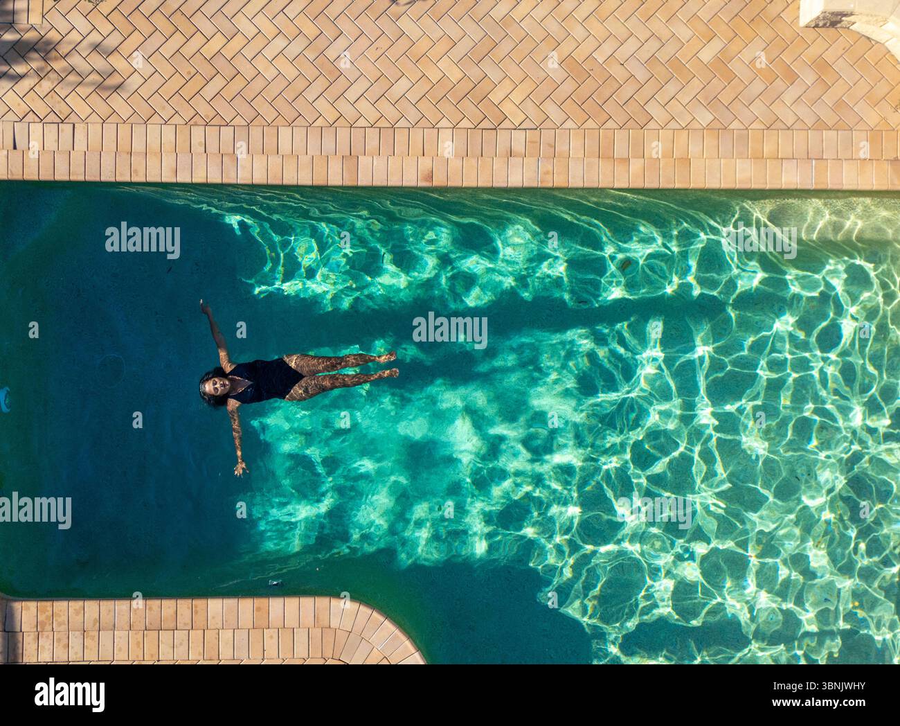 Woman floating peacefully on back hi-res stock photography and images ...
